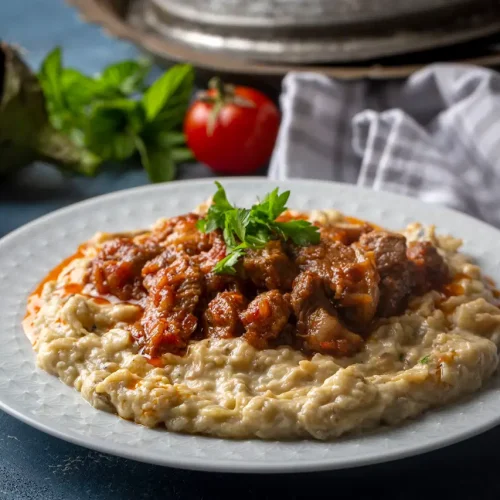 Hünkar Beğendi with lamb stew served over creamy eggplant purée