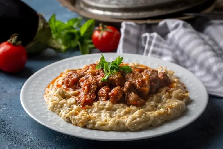 Hünkar Beğendi with lamb stew served over creamy eggplant purée
