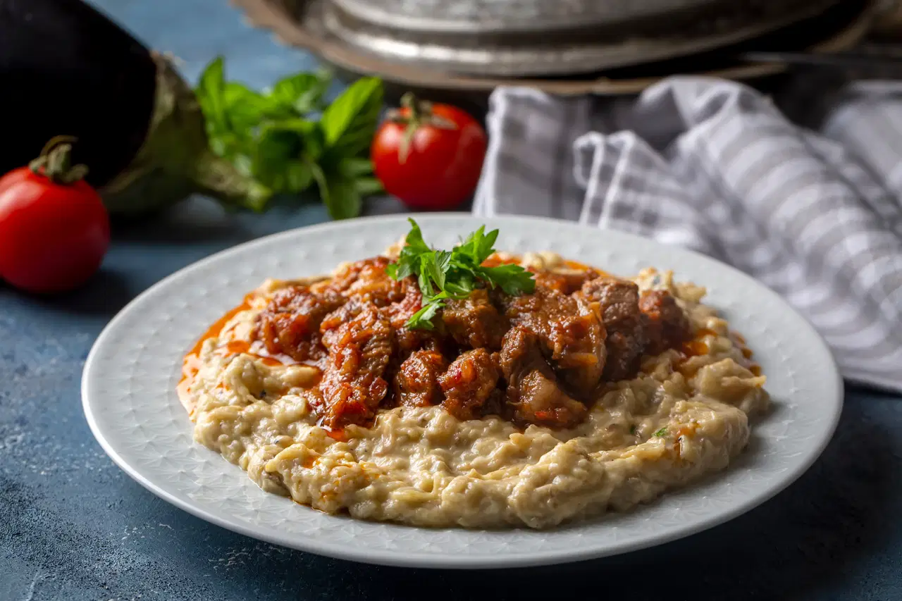 Hünkar Beğendi with lamb stew served over creamy eggplant purée