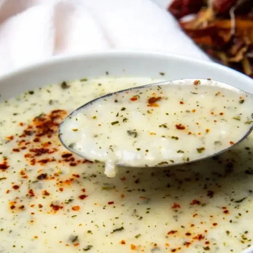 Creamy Turkish yogurt soup in white bowl